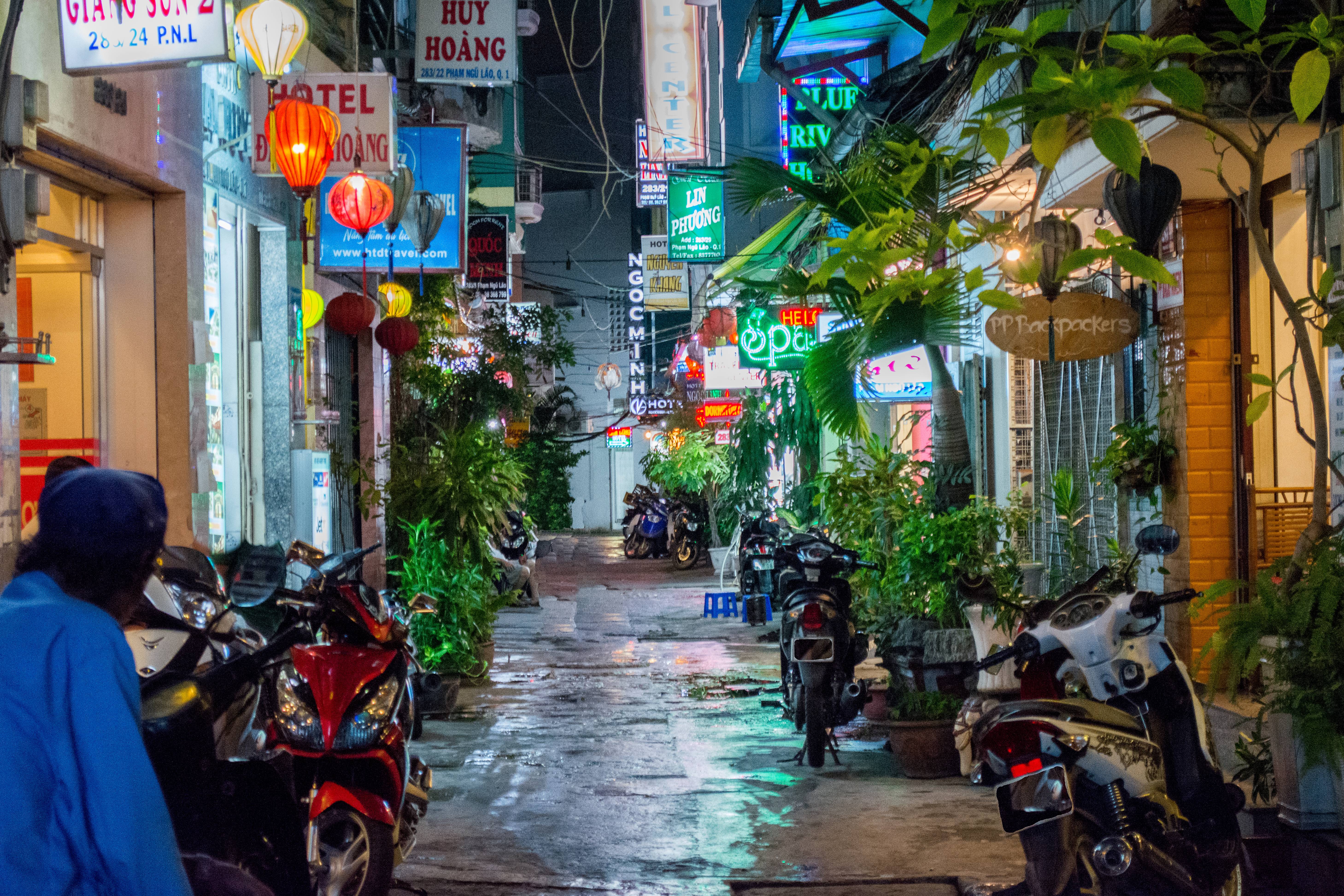 Vietnam Tour - Vietnam Private Tours - Ker & Downey World Travel - Neon-lit Alleyway in Ho Chi Minh City