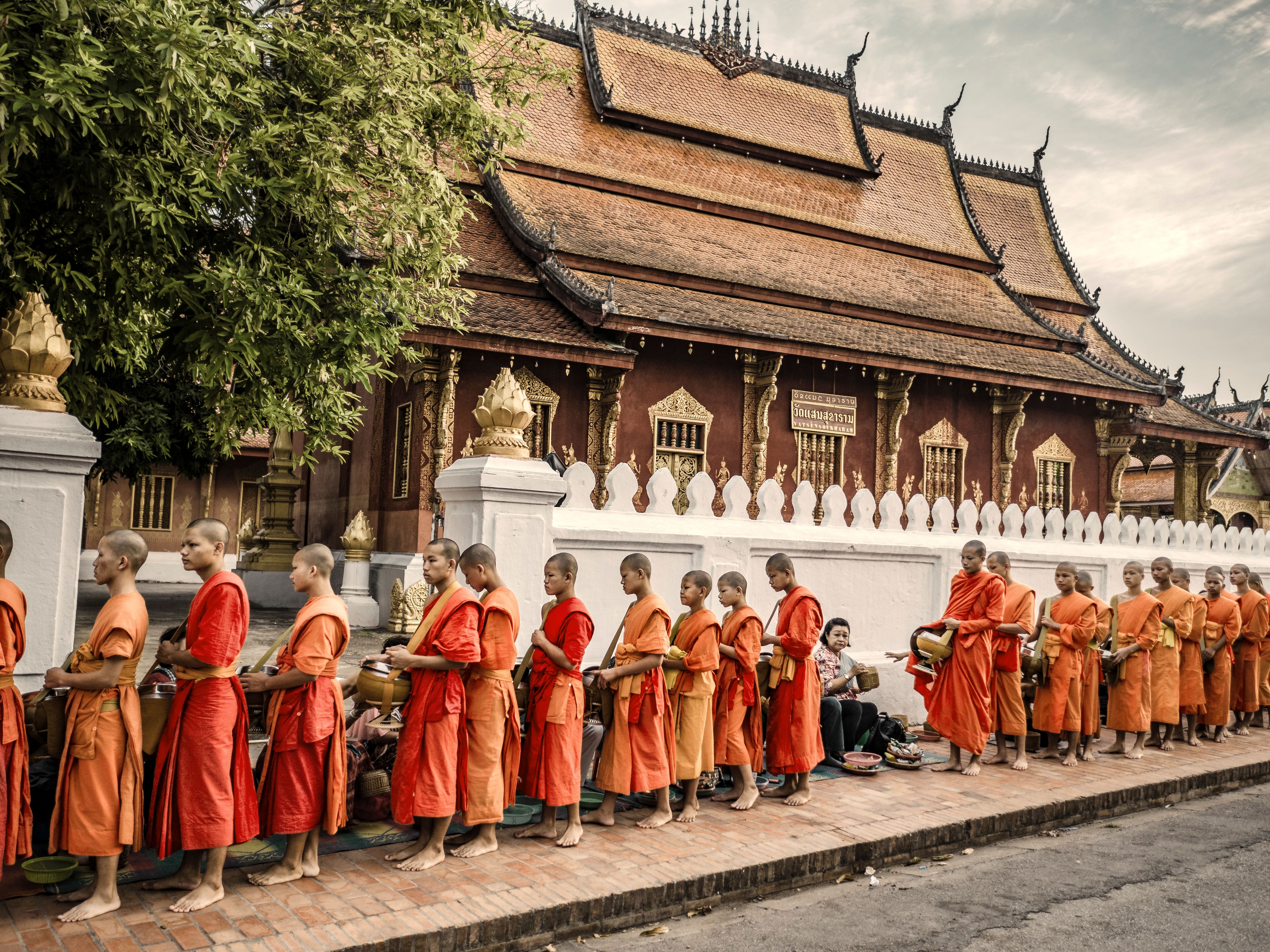 Luxury Laos Mekong River Cruise - Mekong River Cruise Small Boat - Buddhist monks morning alms - Ker & Downey World Travel