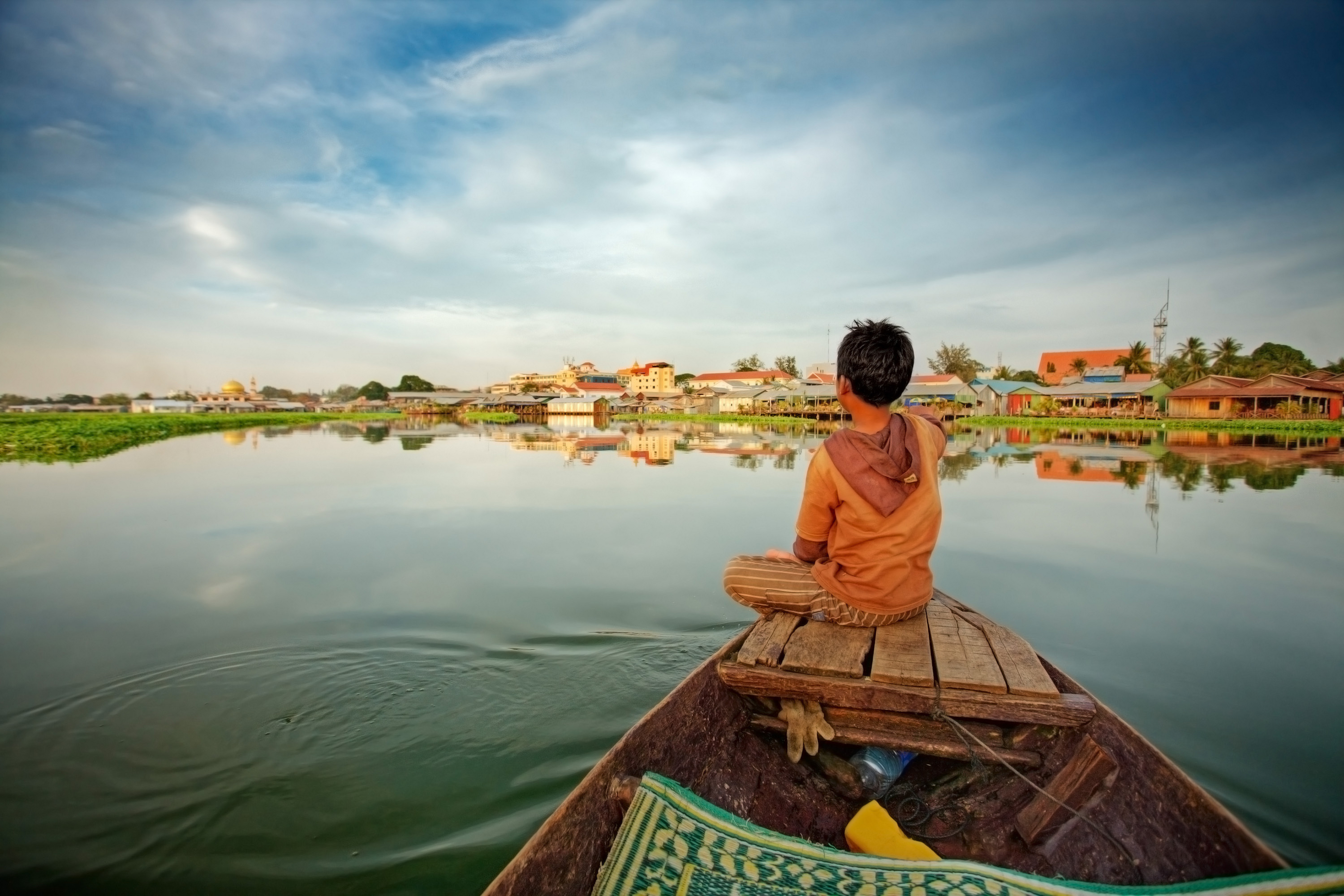 Cambodia Tour Cambodia Tour Package Child Riding Boat On Tonle Sap Lake Ker & Downey World Travel HERO
