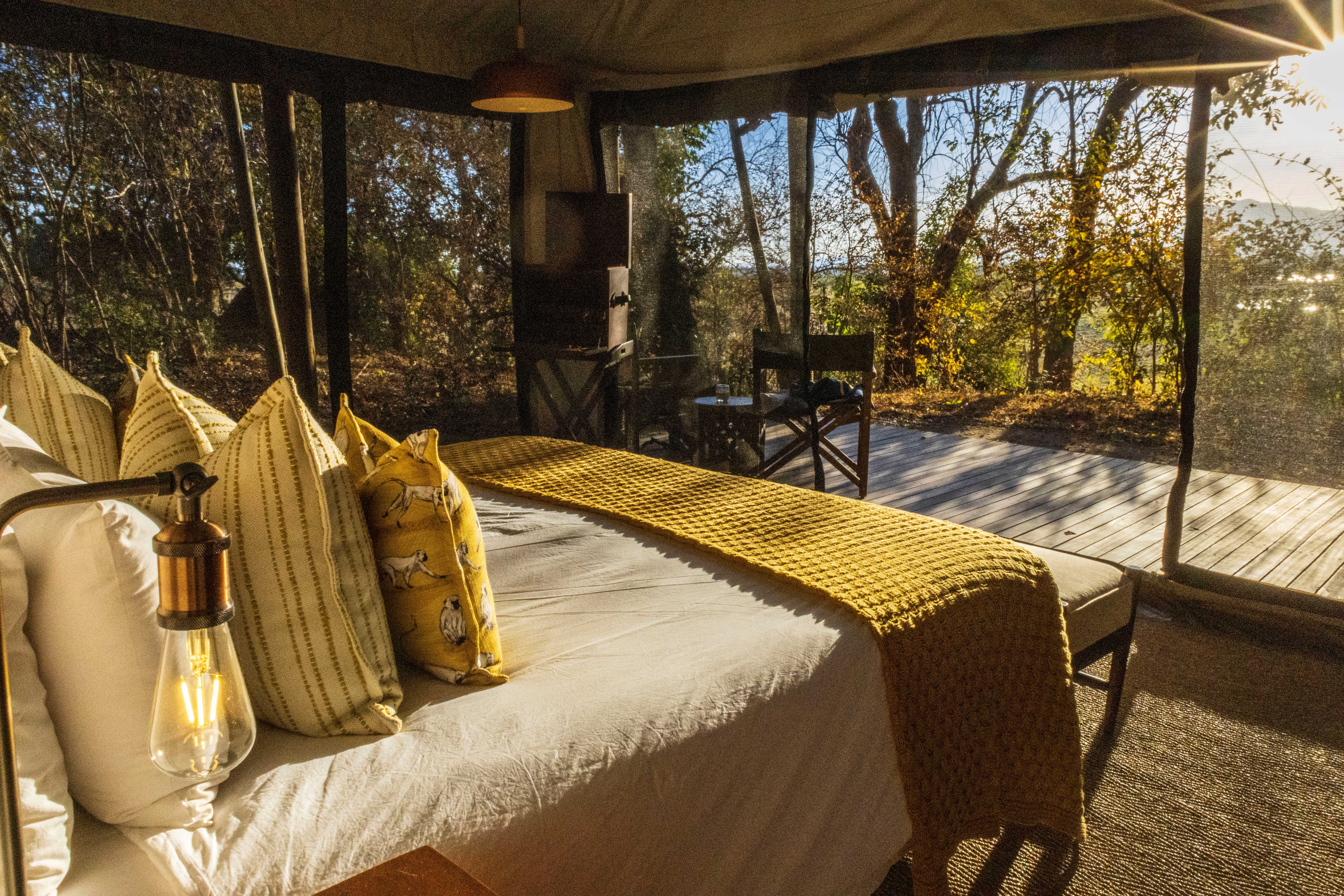 Mana Sands - Luxury Zimbabwe Safari Camps - Ker & Downey World Travel - Interior of Little Mana Sands Tent at Golden Hour