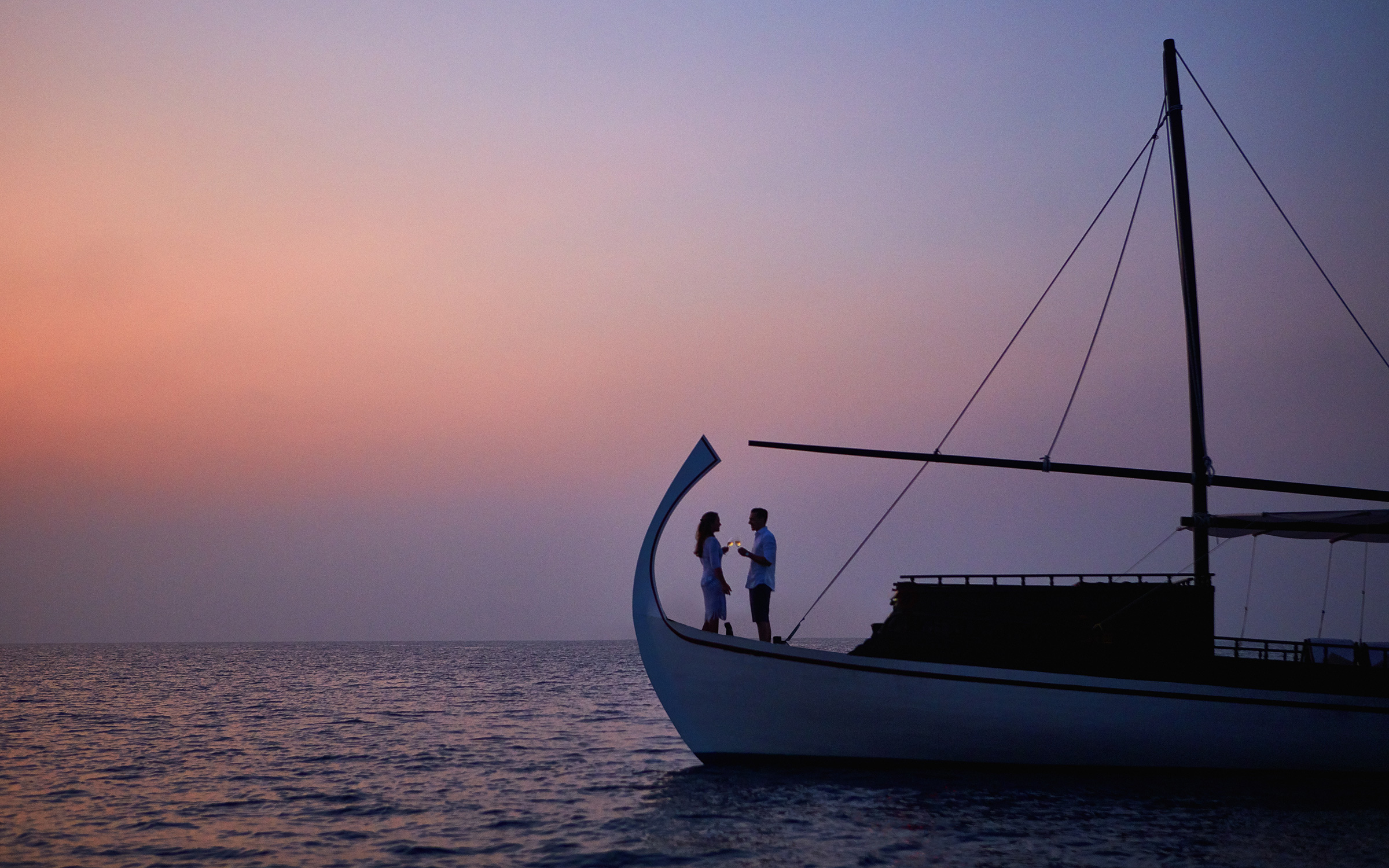 couple on a boat in the middle of the ocean